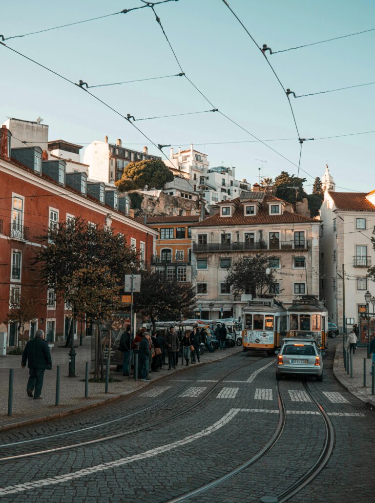 Lisbon street scene with yellow tram and historic buildings in Portugal