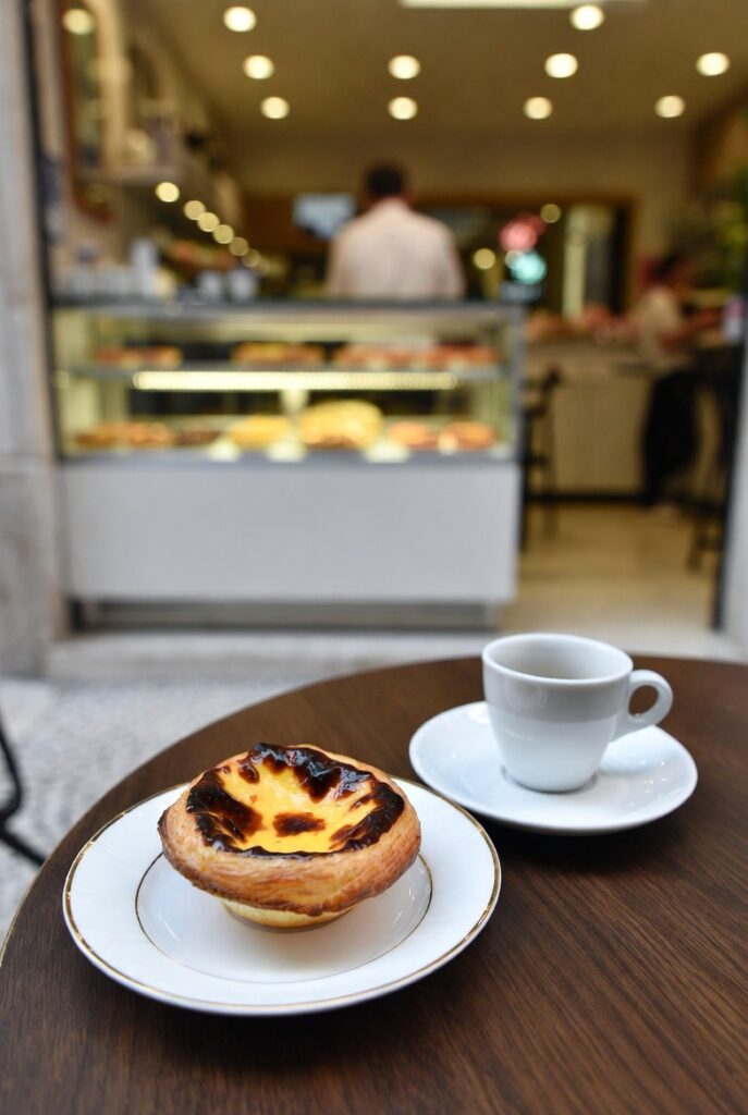 Pastel de nata and espresso in a Porto pastry shop