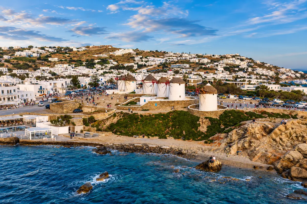 Mykonos windmills overlooking the Aegean Sea after traveling from Athens to Mykonos