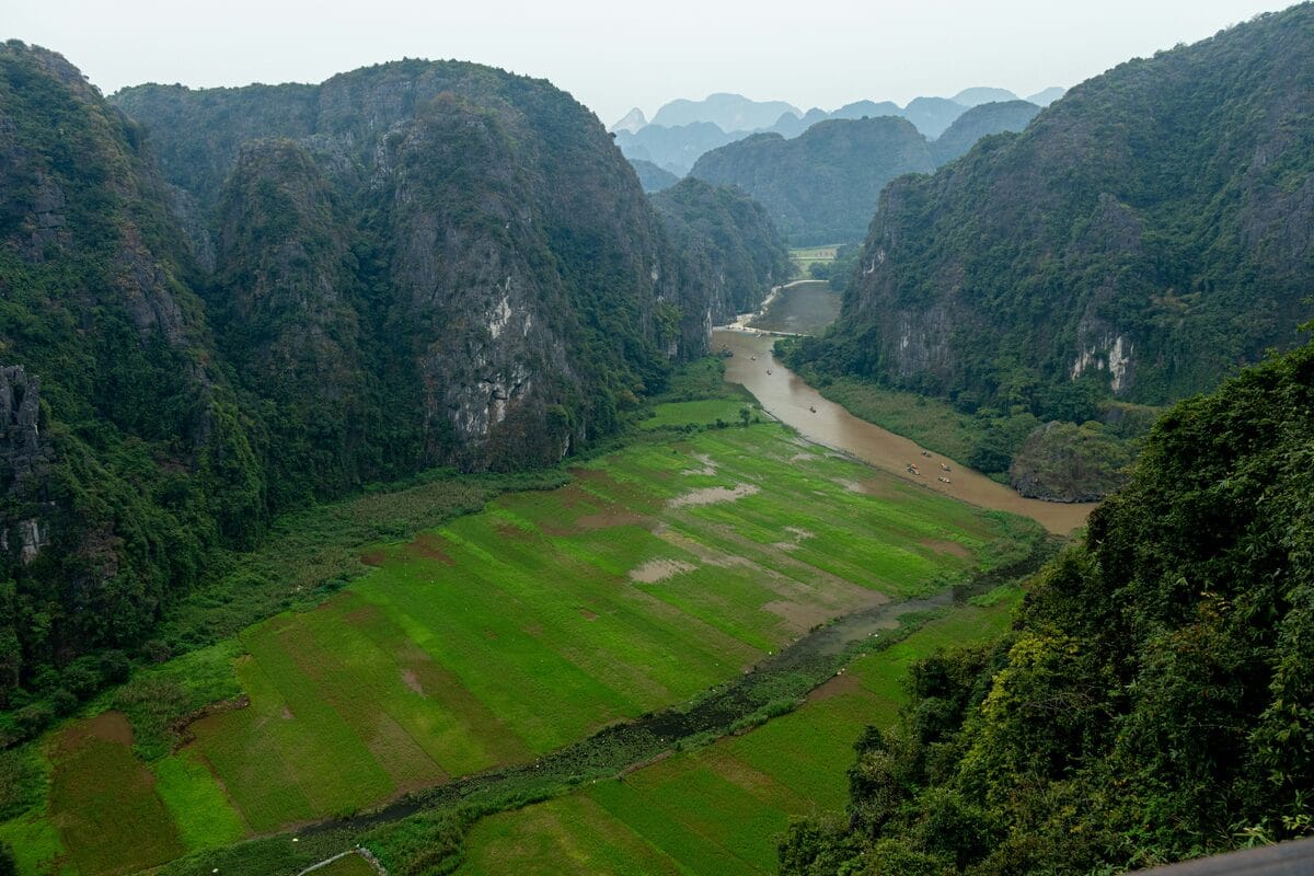 Tam Coc valley and river surrounded by limestone mountains