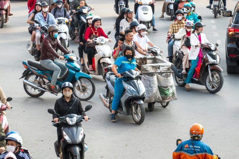 Motorcycle traffic at a busy junction in Hanoi, Vietnam